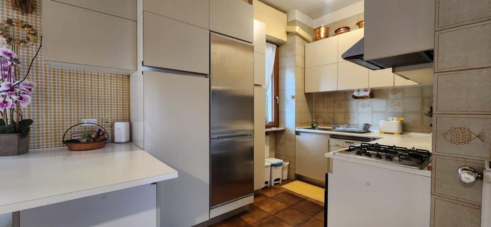 Kitchen or kitchenette, oven, stove, laundry