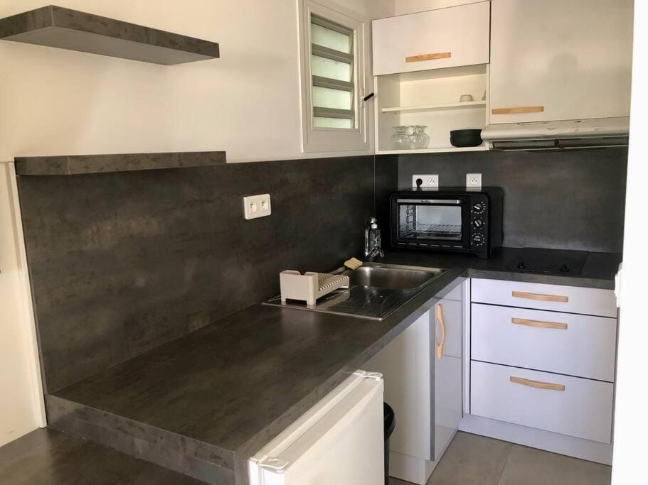 Kitchen or kitchenette, oven, stove, toaster