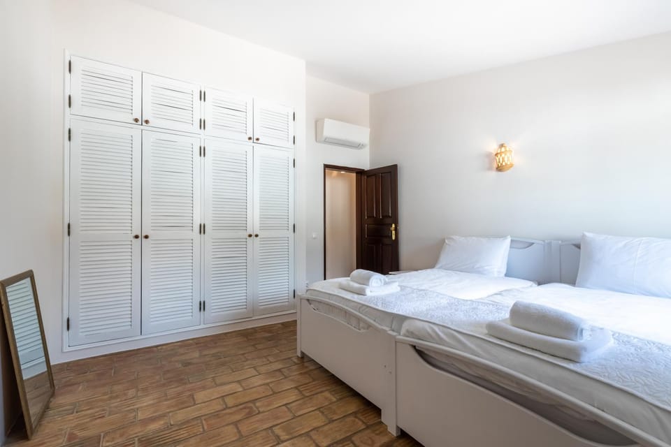 Bedroom, towels, wardrobe, air conditioner