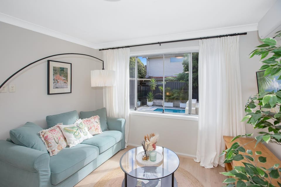 Living room, Seating area, Pool view