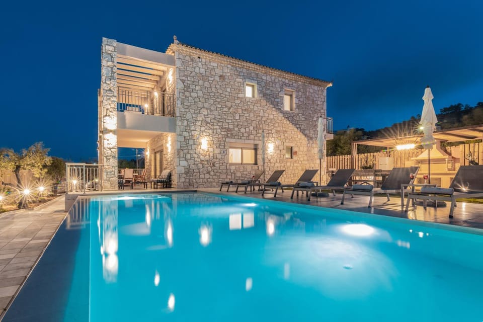 Property building, Patio, Night, Pool view, Swimming pool, sunbed