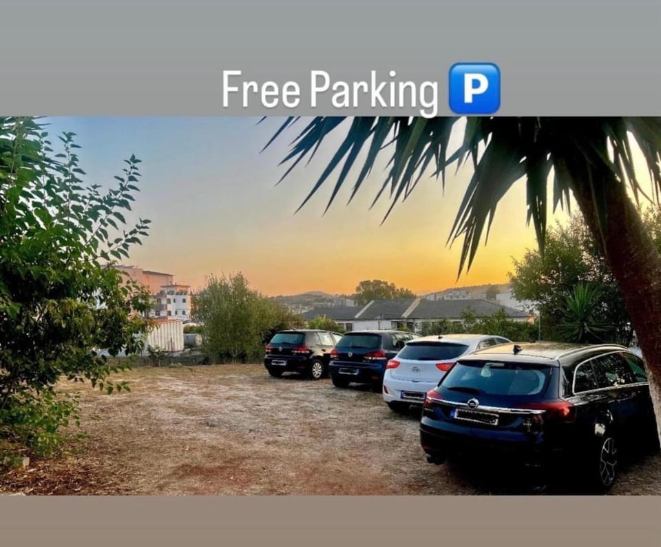 Day, Natural landscape, Text overlay, Street view, Parking