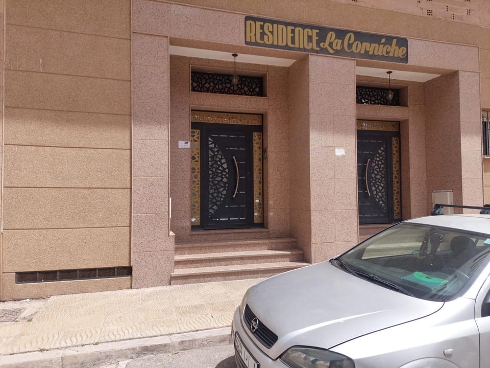 Facade/entrance, Text overlay, Street view, Parking