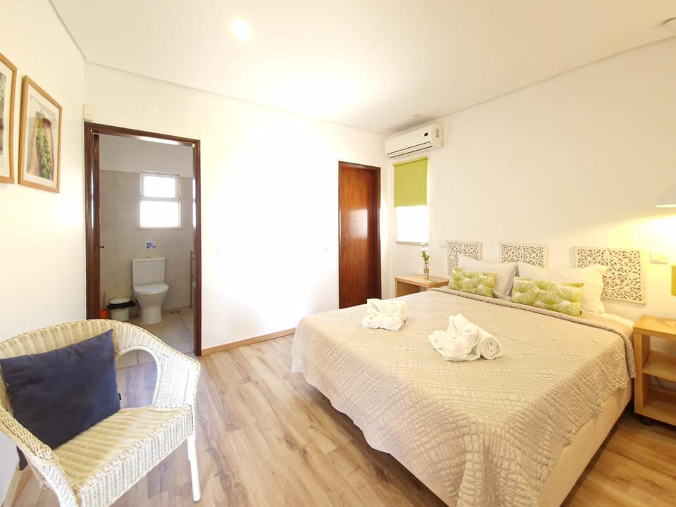 Bed, Living room, towels, air conditioner