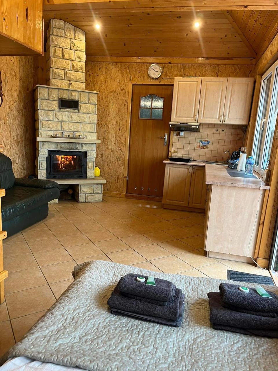 Kitchen or kitchenette, flat iron, stove, towels