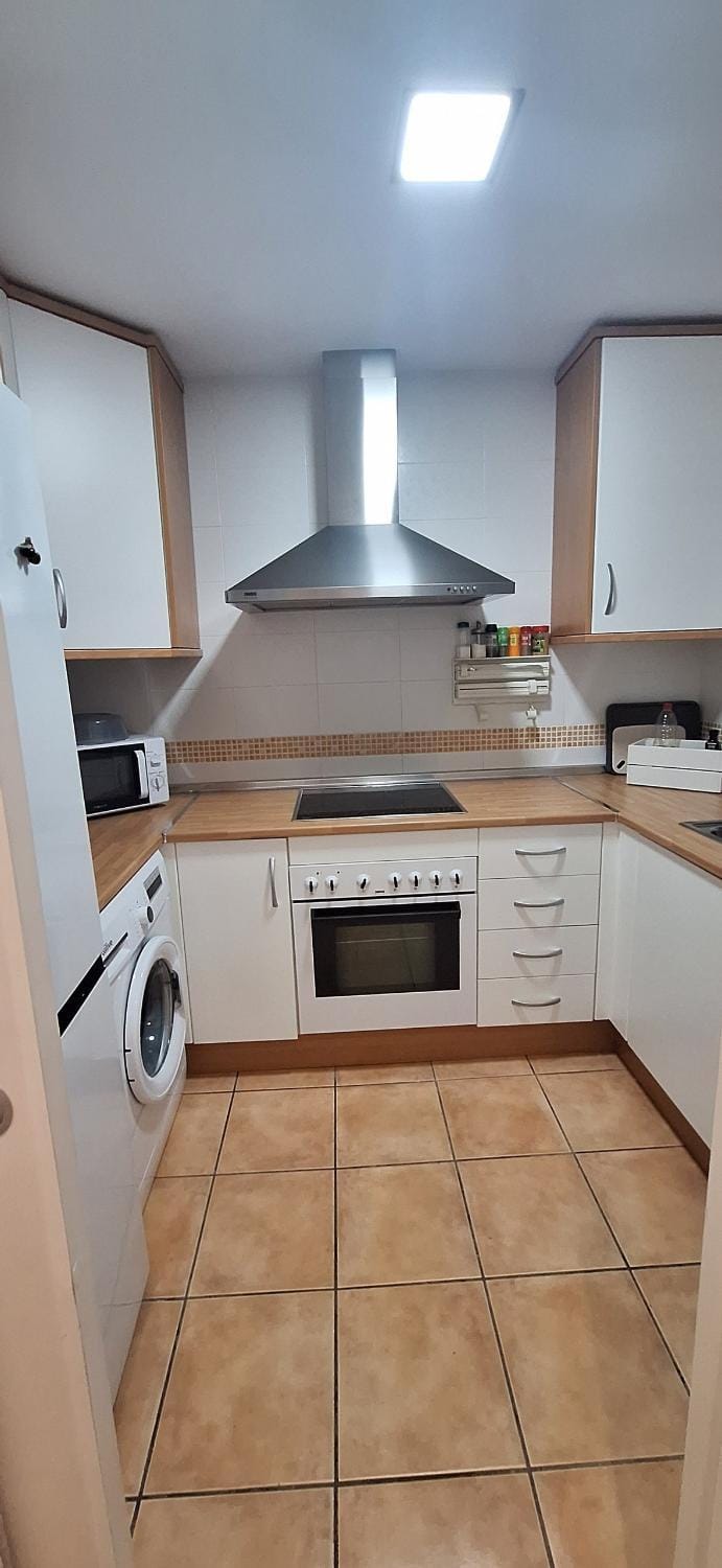 Kitchen or kitchenette, dishwasher, stove, washing machine