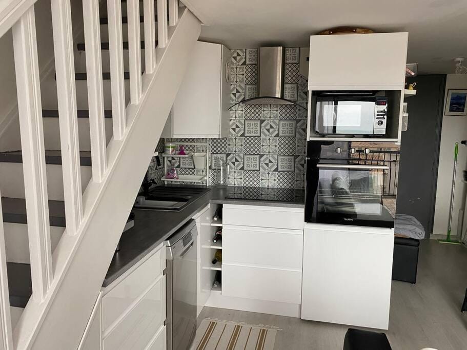 Kitchen or kitchenette, dishwasher, oven, stove, toaster