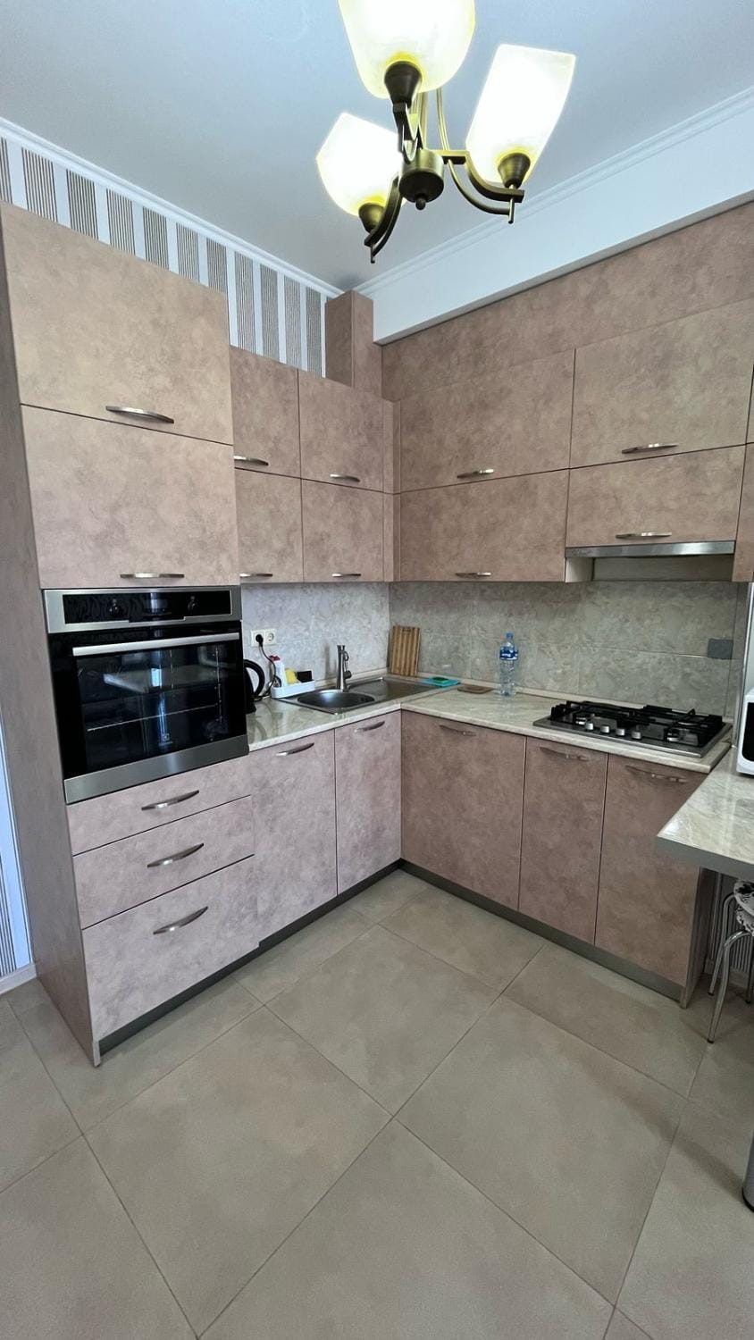 Kitchen or kitchenette, oven, stove, washing machine
