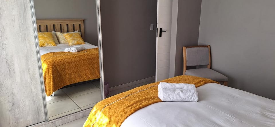 Bed, towels, wardrobe