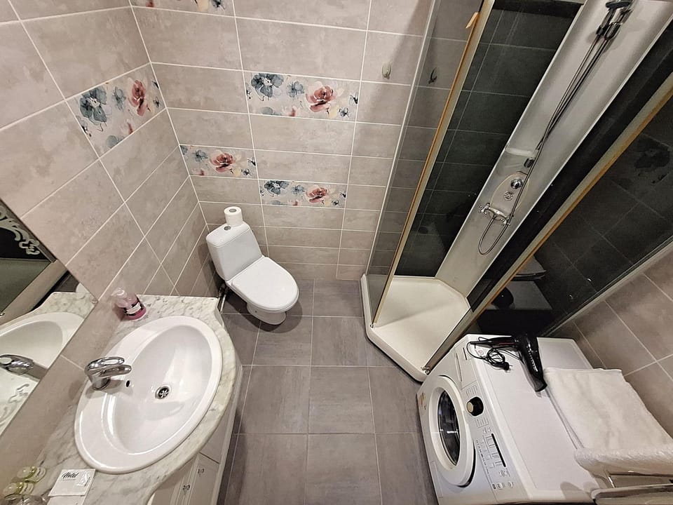 Shower, Toilet, Bathroom, hair dryier, towels