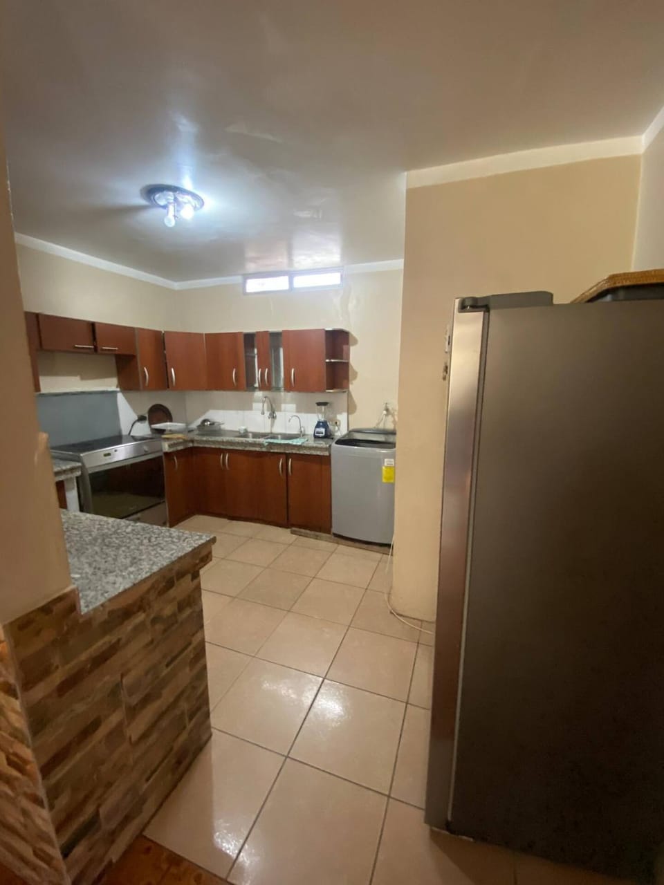 Kitchen or kitchenette, dishwasher, oven, stove