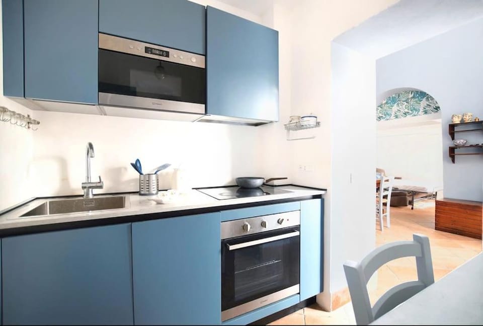 Kitchen or kitchenette, dishwasher, microwave, oven, stove