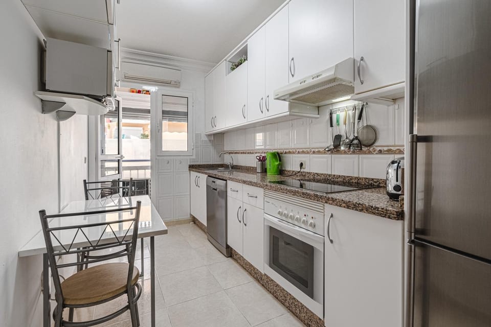 Kitchen or kitchenette, dishwasher, oven, toaster, air conditioner