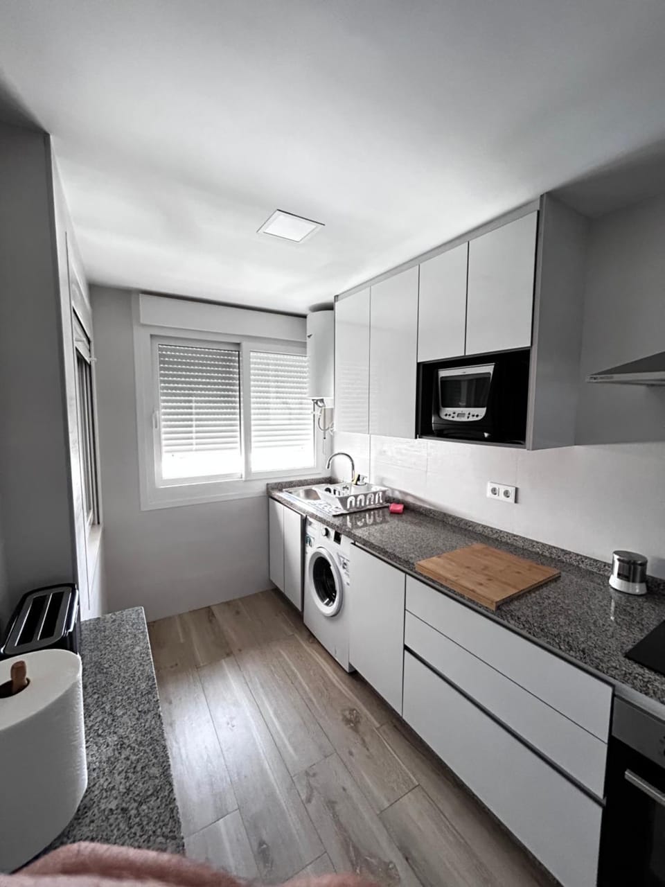 Kitchen or kitchenette, oven, stove, washing machine