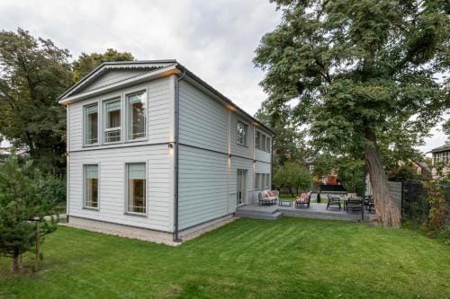 Suite with private bathroom at three bedroom interwar Villa Grabyte with daily spaces to share by pi Hotel in Lithuania
