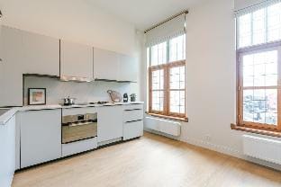 Modern apartment located at historical Main Square Hotel in Antwerp