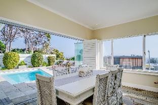Beach-style Camps Bay Home w Pool   Garden  Barbados Hotel in Camps Bay