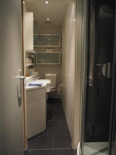 Bedroom cum office with shared shower in Zug's Old Town Hotel in Zug