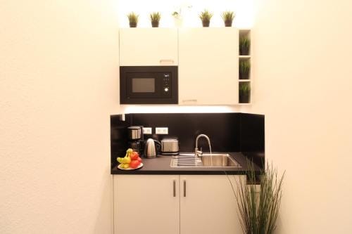 Hotel Ulm Zentrum - Komplettes Zimmer, Hochbett, Android TV & eigenem Bad - perfekt fur Familien & G Hotel in Neu-Ulm
