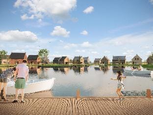 Luxury villa with sauna, located on the water in a holiday park Hotel in Wolphaartsdijk