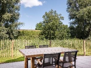 Luxury villa with sauna, located on the water in a holiday park Hotel in Wolphaartsdijk