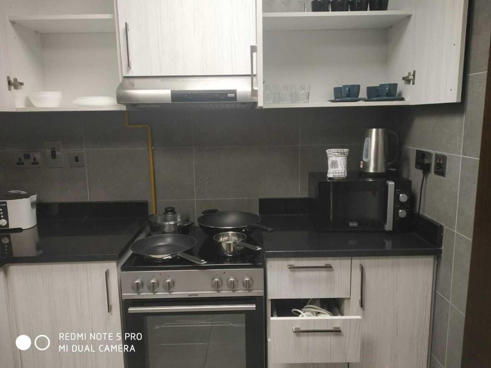 OYO HOME 1381 Premium 1 BHK With Balcony Hotel in Abu Dhabi