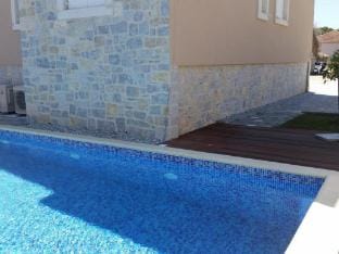 Apartments Villa Rustica ST - Two-Bedroom Apartment with Balcony and Shared Pool prizemlje Hotel in Biograd na Moru