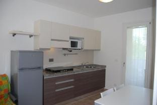 Homely apartment with swimming pool in a village Hotel in Bibione