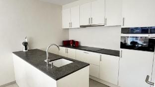 Huswell - Family-friendly apartment in Nieuwpoort with shared summer pool Hotel in Koksijde