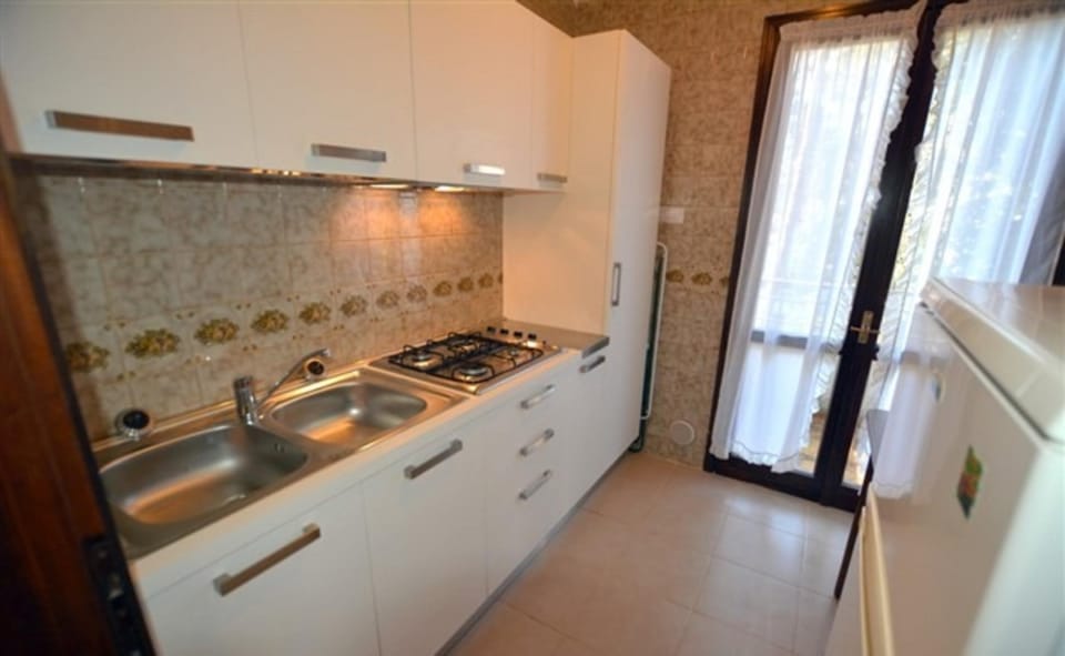 Large row house with private fenced garden for 10 guests in Lignano Pineta Resort in Lignano Sabbiadoro