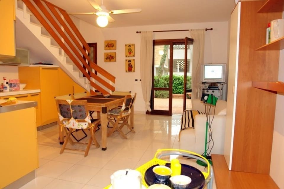 Excellently equipped row house with fenced garden for 8 in Lignano Pineta Resort in Lignano Sabbiadoro
