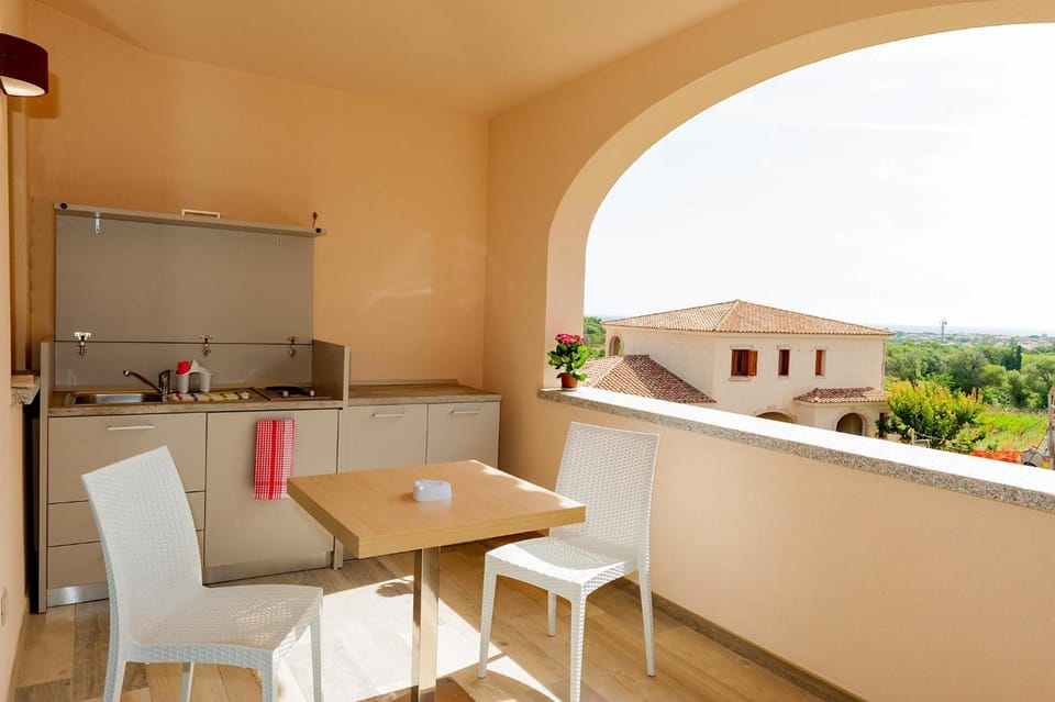 MOLAROTTO CAMERE CON ANGOLO COTTURA Apartment hotel in Sardinia