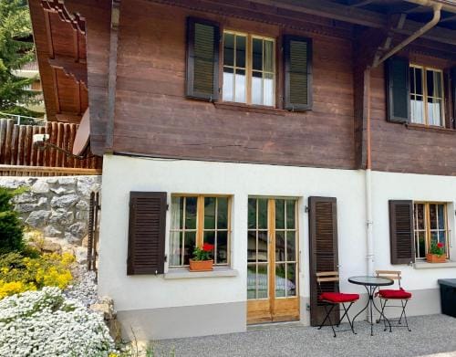 One Bedroom with mountain and garden view ground floor of Chalet Solaria Hotel in Saanen