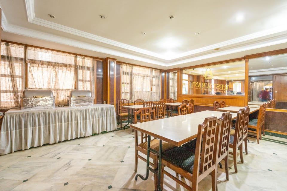 Capital O Adarsh Inn Near Cubbon Park Hotel in Bengaluru