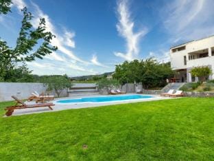 Serene Rural Villa with Pool, Sun Deck, and Childrens Play Area - Five Bedroom Villa Hotel in Split-Dalmatia County