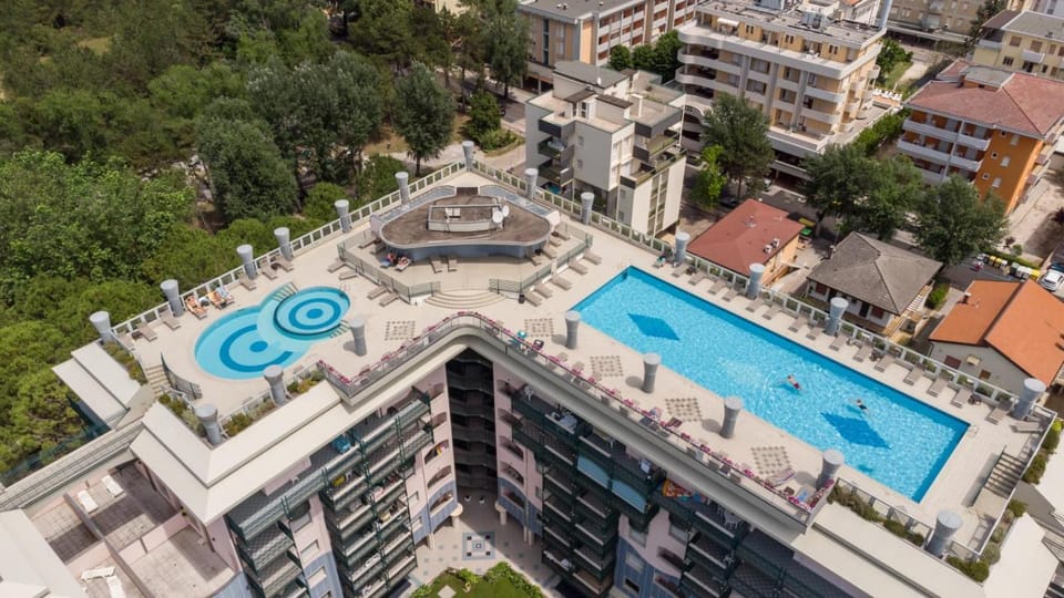 Spacious terrace in a green oasis Hotel in Bibione