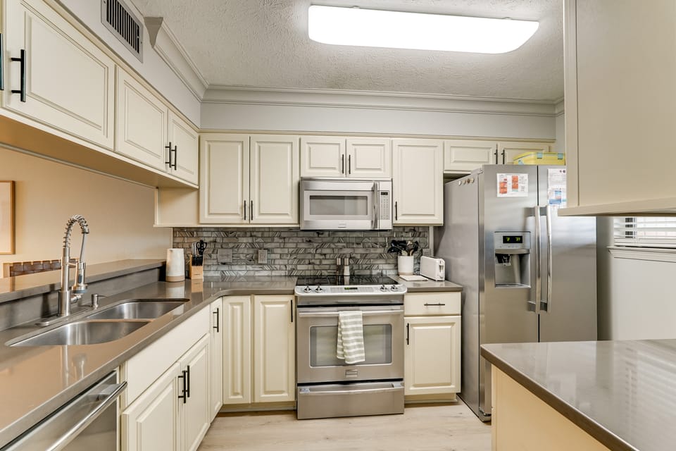 West End PCB: Partial Gulf Views | Steps to Beach Apartment in Laguna Beach