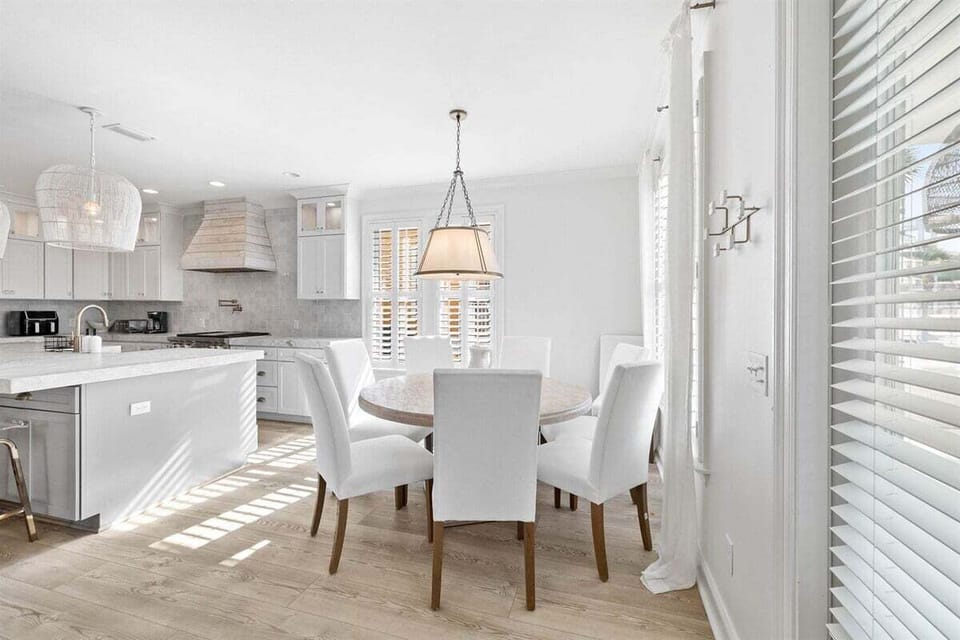 White tones and elegant lighting make mealtimes a delight.