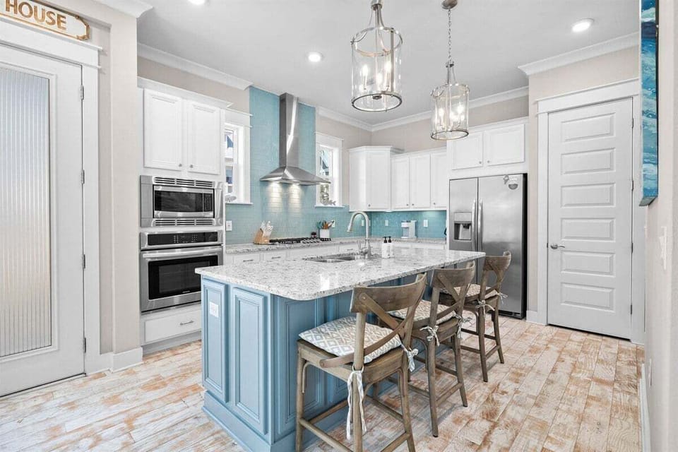 A stunning kitchen with sleek countertops, pendant lighting, and a spacious island.
