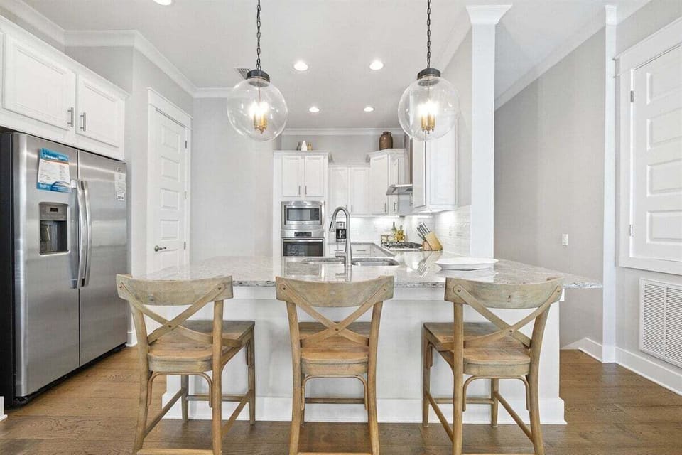 Modern kitchen is fully stocked and ready to whip up any meal.