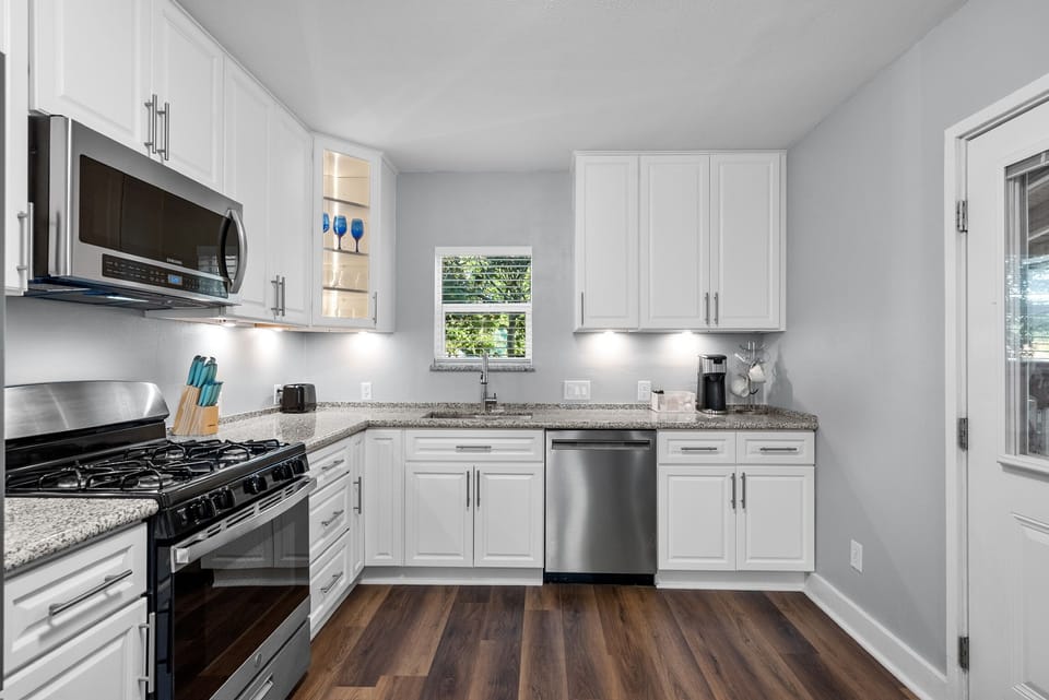 Under cabinet lighting, single-serve coffee maker + coffee. 