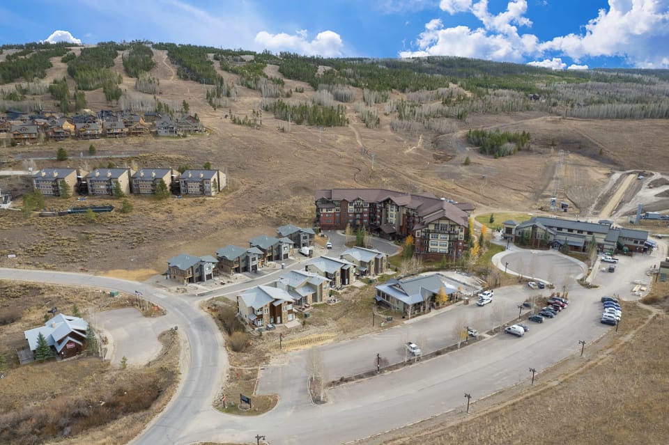 - Scenic aerial view highlights mountain community and surrounding trails   - Modern homes nestled in nature for a peaceful vacation experience   - Perfect basecamp location for skiing, biking, and outdoor exploring