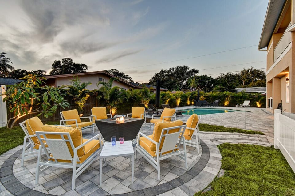 Expansive outdoor oasis with luxury fireplace; heated and cooled pool