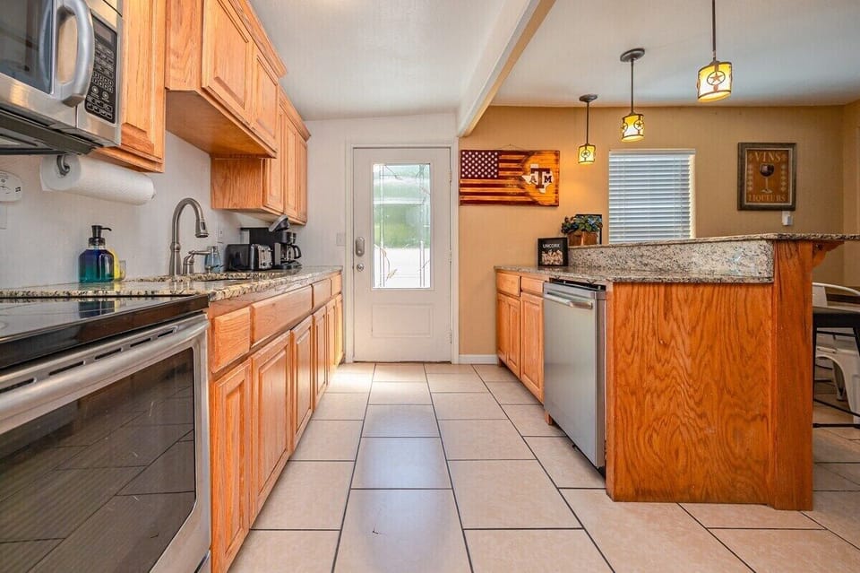 Well-equipped kitchen, perfect for culinary adventures. Whip up a feast in this stylish kitchen.