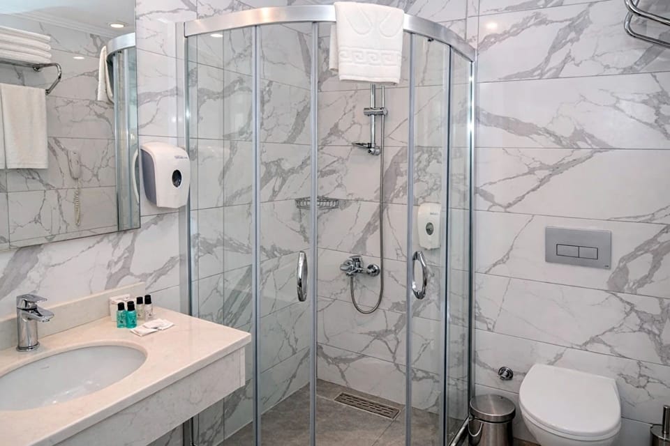 Shower, free toiletries, hair dryer, slippers