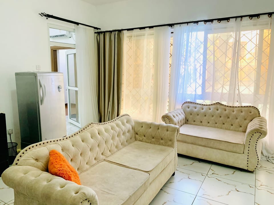 Business Apartment | Living area | 24-inch Smart TV with digital channels