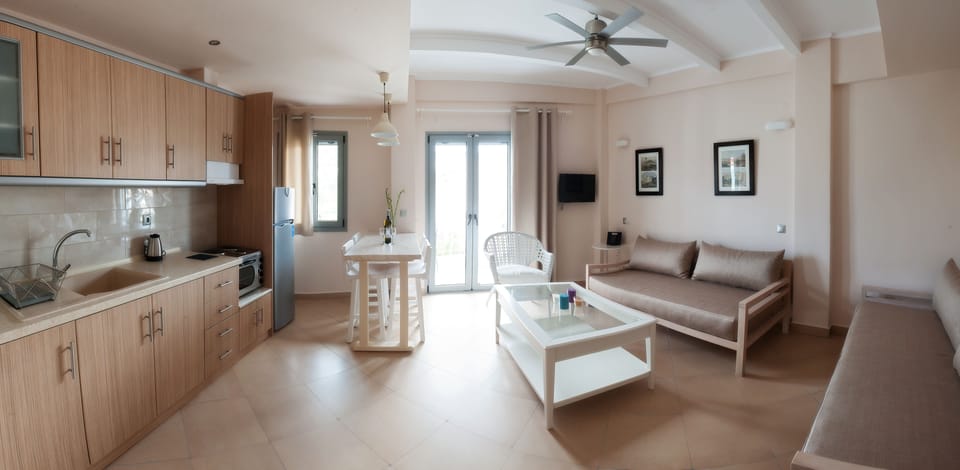 Deluxe Apartment | Living area | 27-inch flat-screen TV with satellite channels, TV