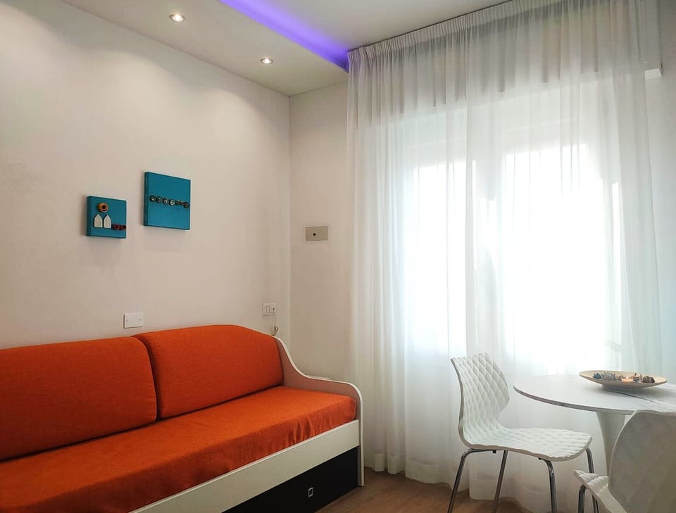Comfort Suite | Living area | 32-inch flat-screen TV with digital channels