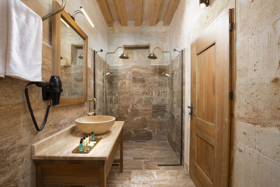 Honeymoon Room | Bathroom | Shower, rainfall showerhead, designer toiletries, hair dryer