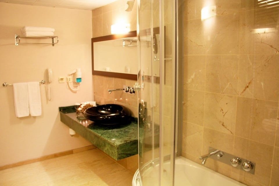 Shower, free toiletries, hair dryer, bathrobes